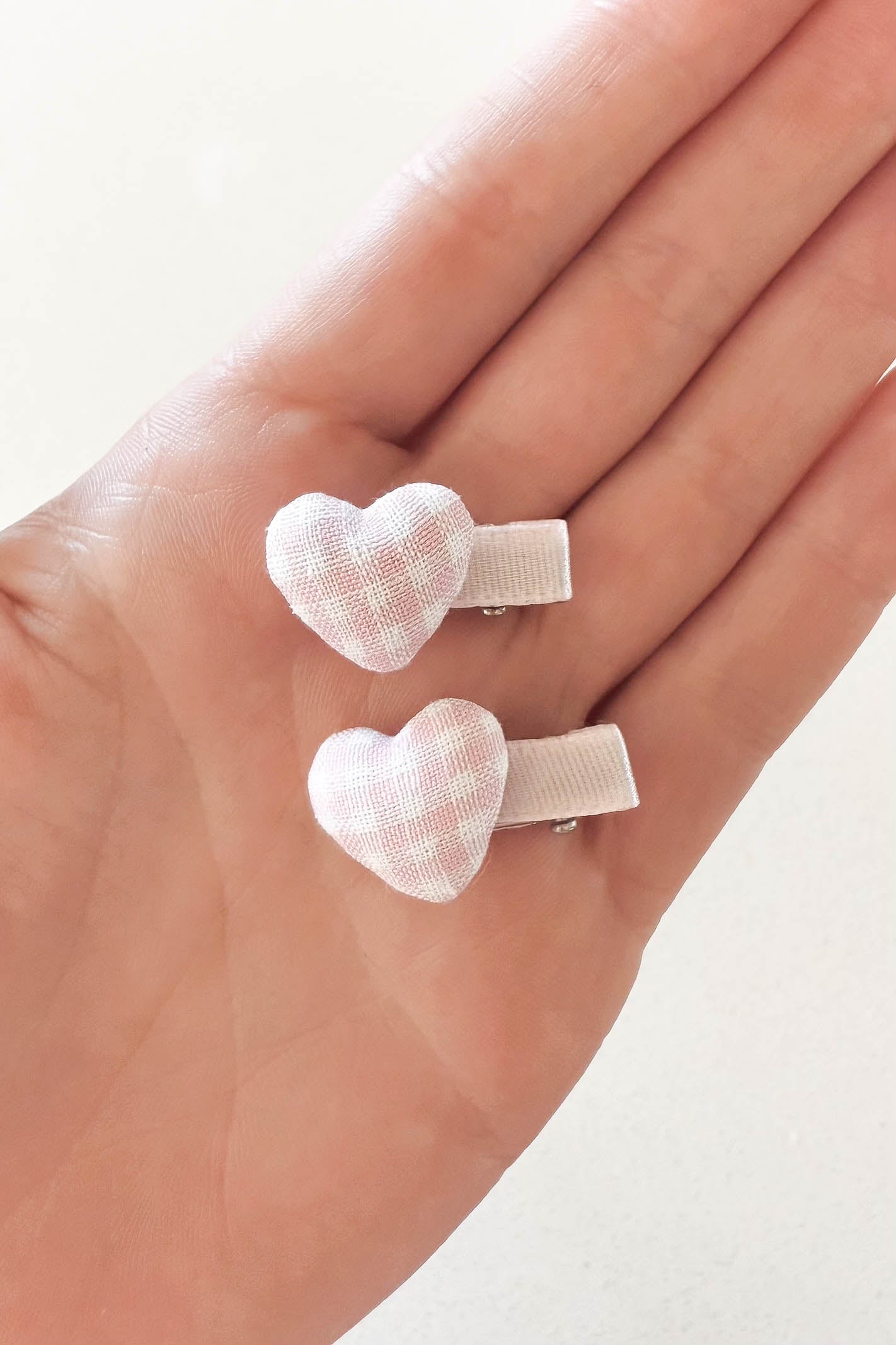 Pink gingham love heart hair clips