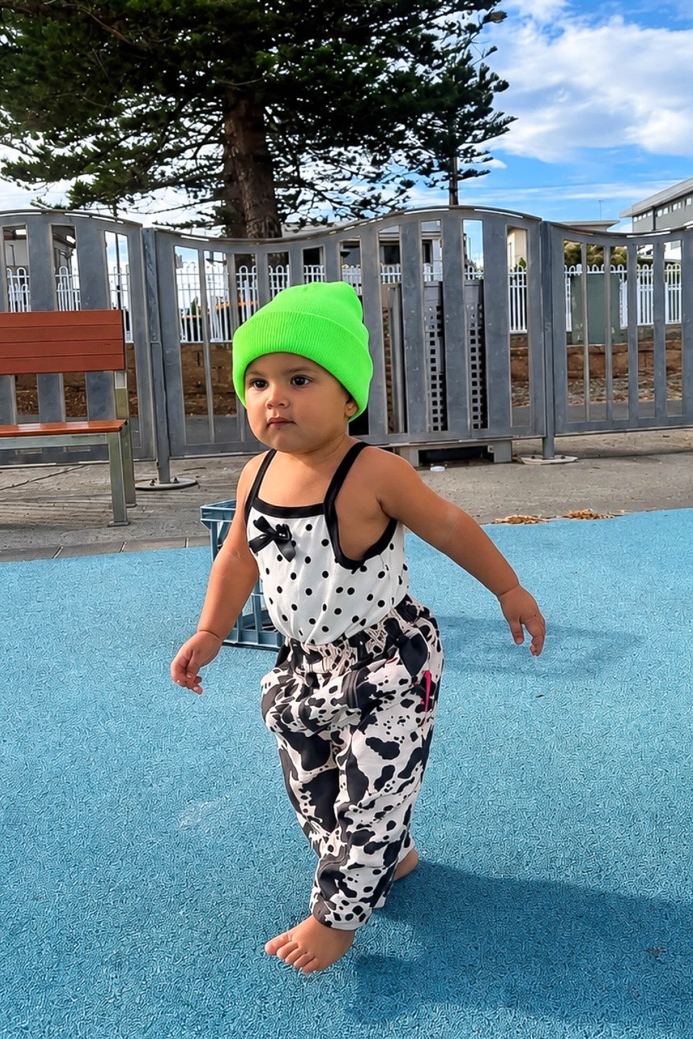 Cream and black polka dot baby bodysuit