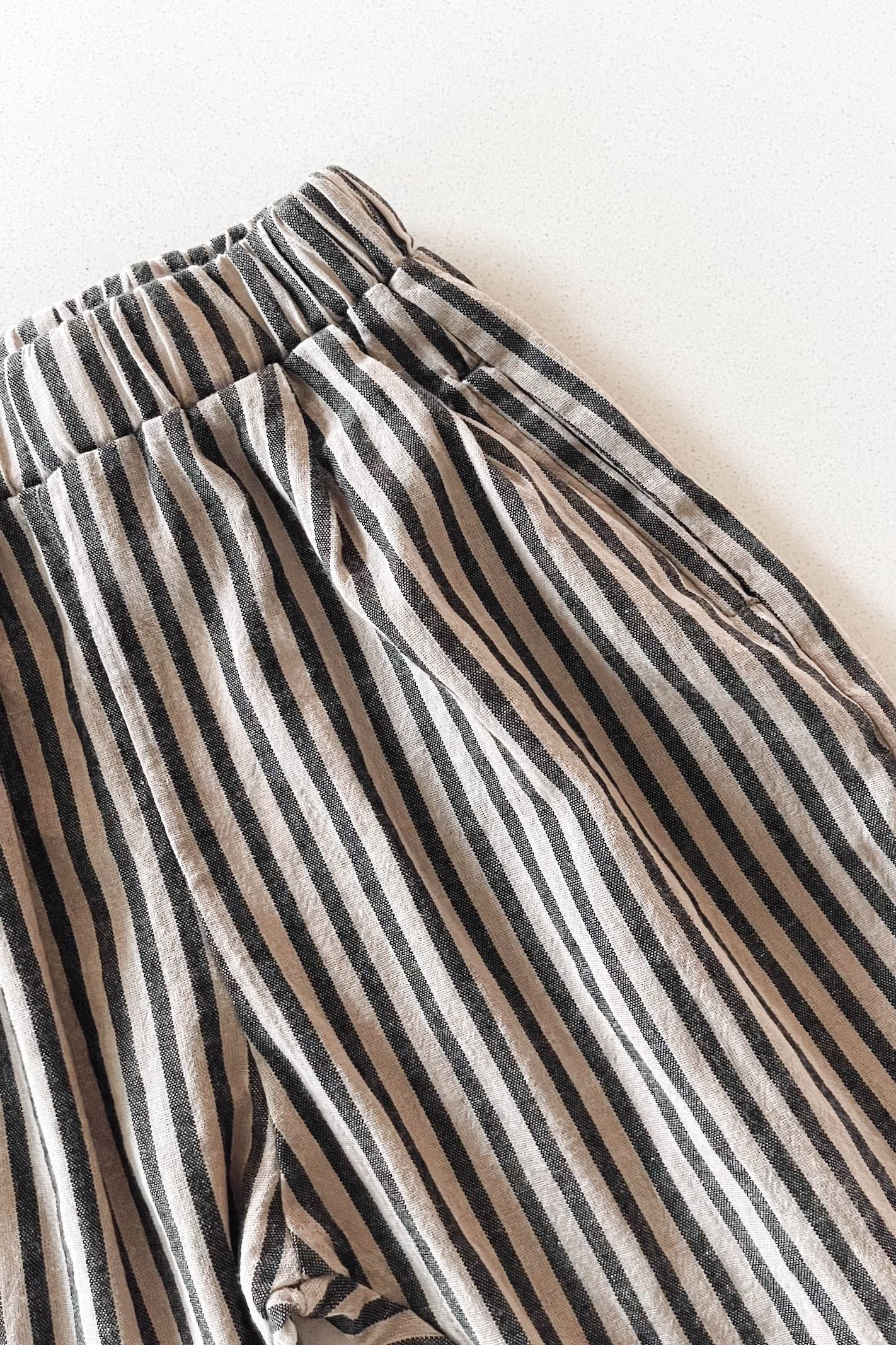 Close-up of striped pants on a white background