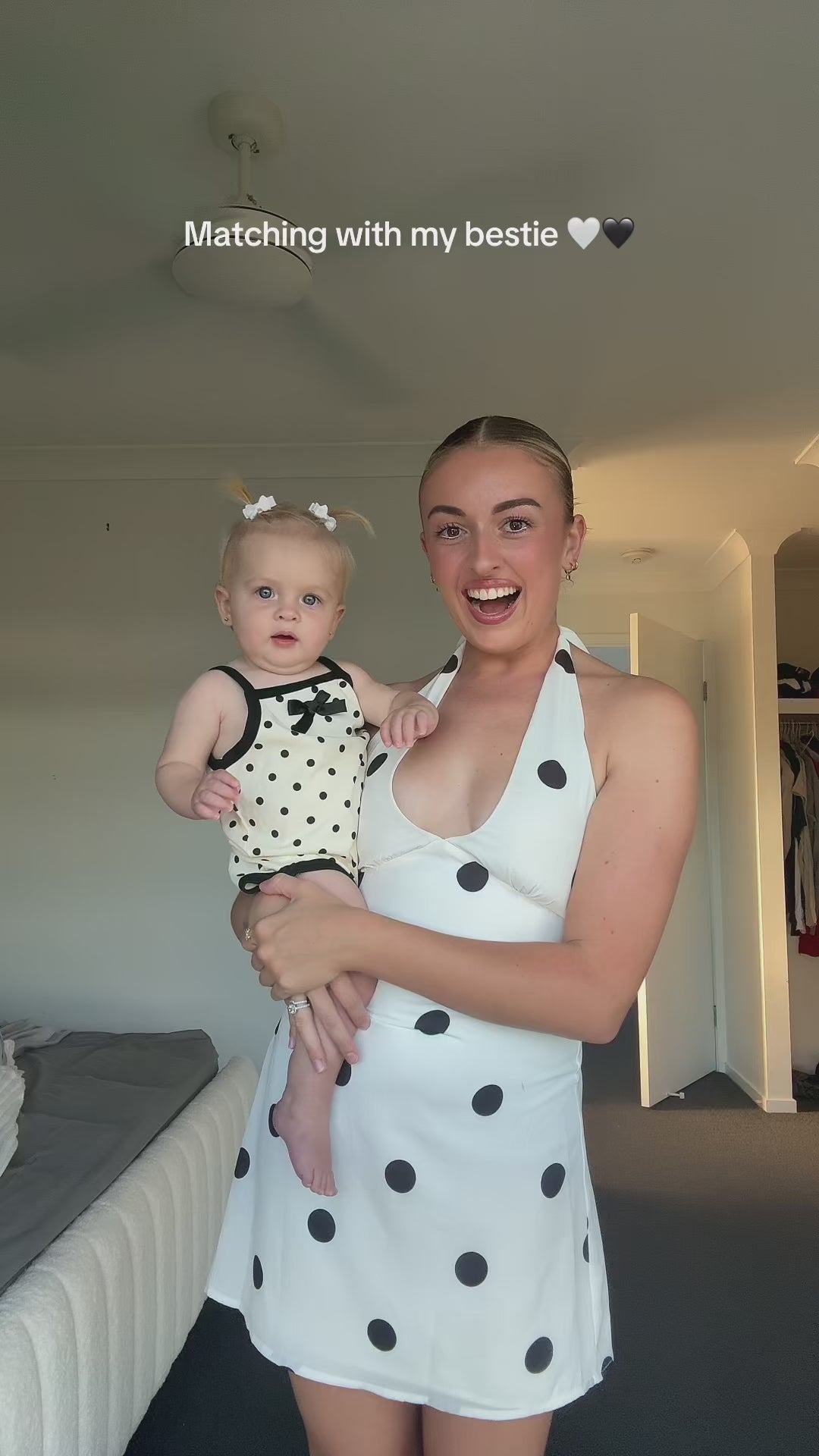 Cream and black polka dot baby bodysuit