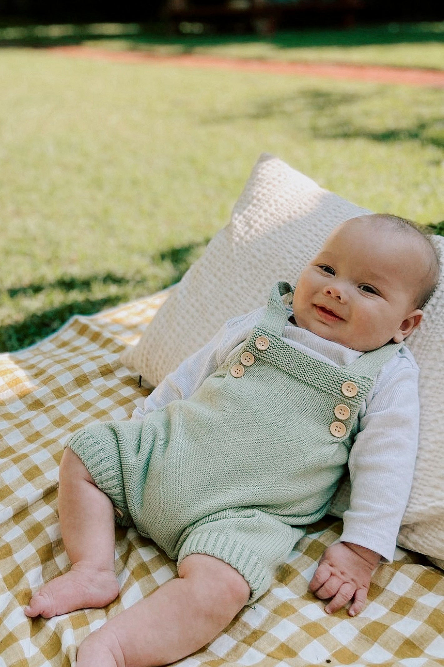 green baby overalls